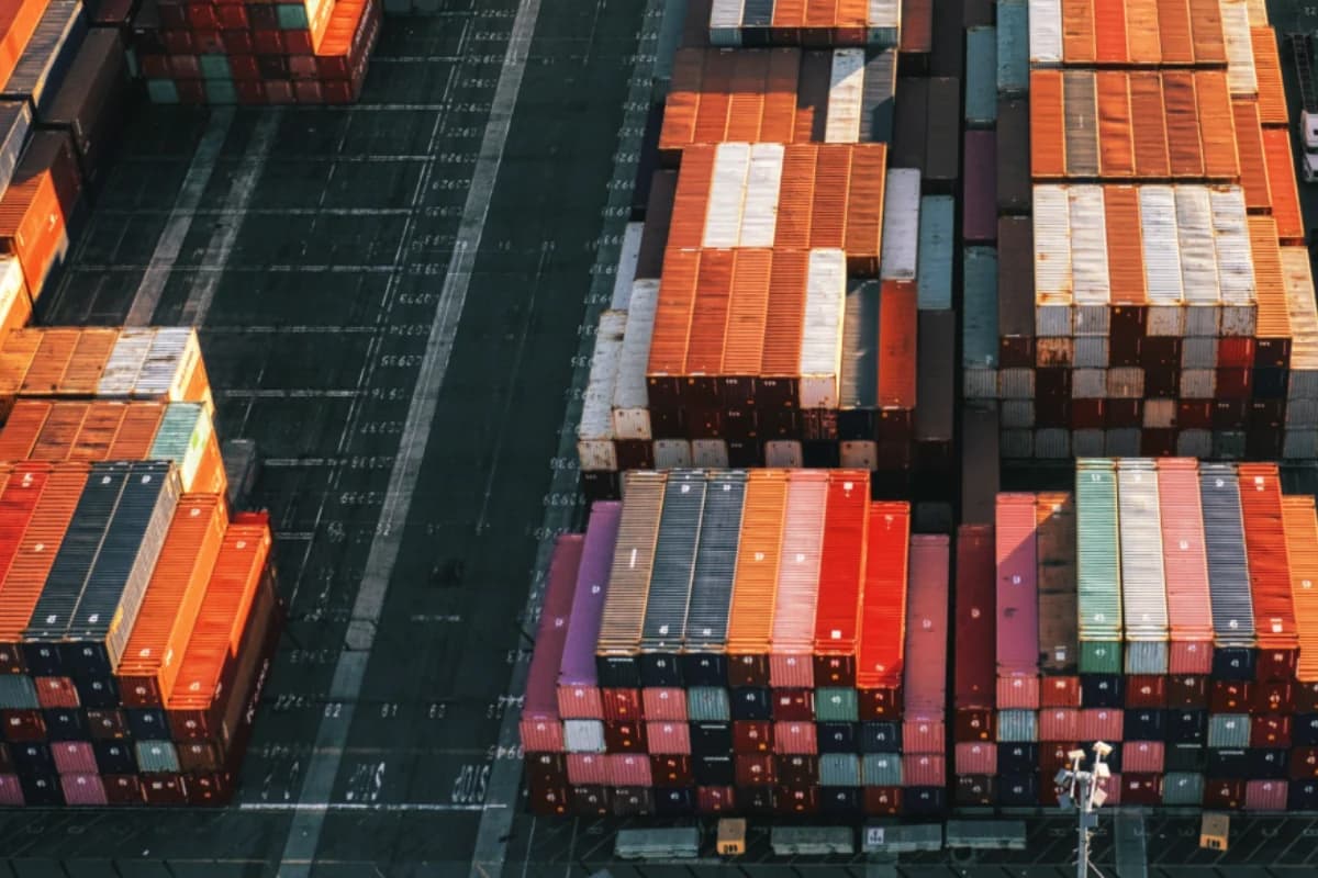 Orange, white and navy containers and transport lanes seen from above.